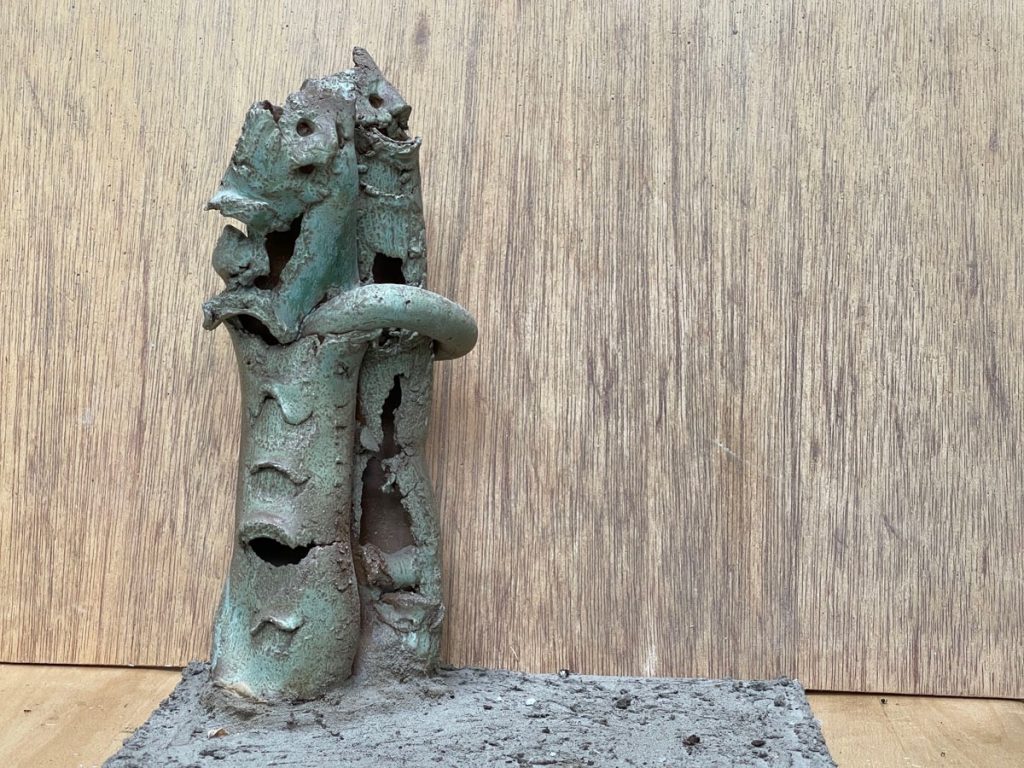 Mary Ann Bowman&nbsp;• <em>Two Holey Guys</em>&nbsp;• Clay and wood&nbsp;• 10″×&nbsp;10″×&nbsp;10″&nbsp;• $325.00