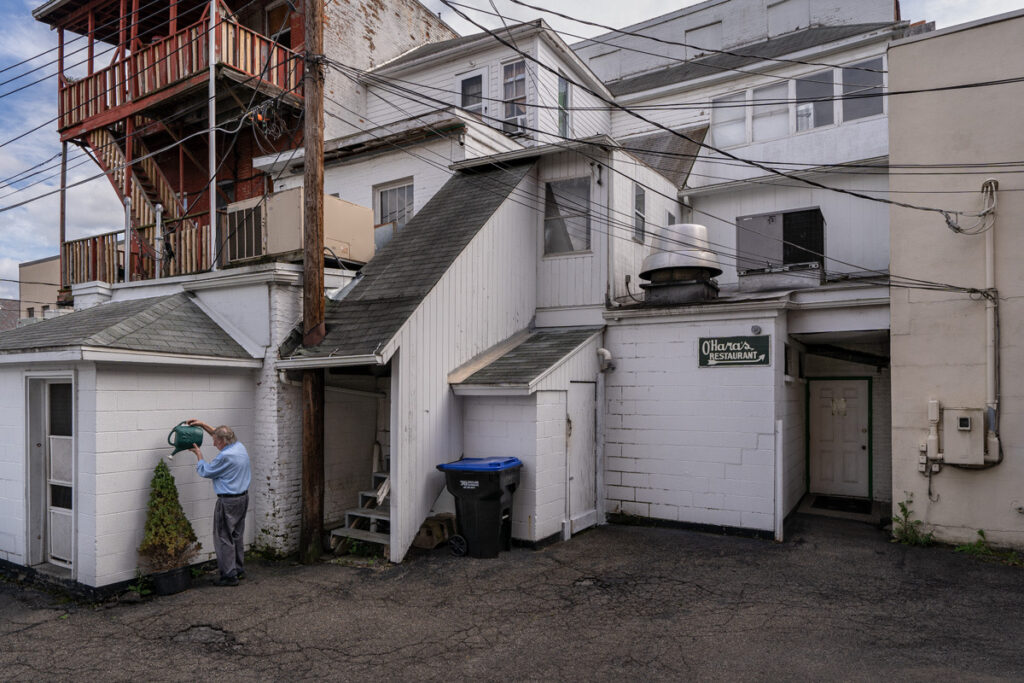 Harry Littell&nbsp;• <em>Off Main Street, Owego, 2021</em>&nbsp;• Archival digital print&nbsp;• 40″×&nbsp;29″&nbsp;• $1,250.00<a class="purchase" href="https://state-of-the-art-gallery.square.site/product/harry-littell-off-main-street-owego-2021/1375" target="_blank">Buy</a>