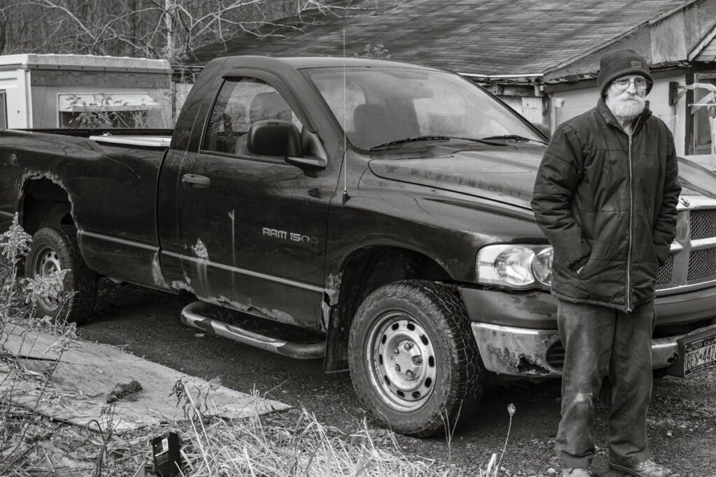 Susan C. Larkin&nbsp;• <em>Ed and his Truck</em>&nbsp;• Archival digital print&nbsp;• 24″×&nbsp;18″&nbsp;• $300.00