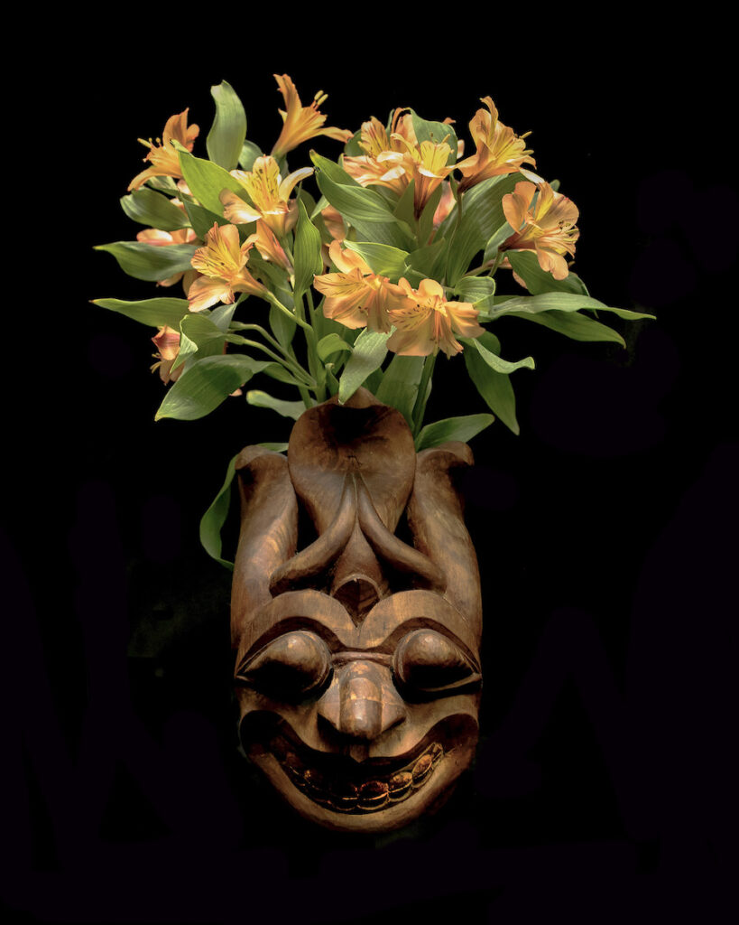 Nancy V. Ridenour&nbsp;• <em>Wood Mask and Alstromeria</em>&nbsp;• Digital print on canvas&nbsp;• 16″×&nbsp;20″&nbsp;• $150.00
