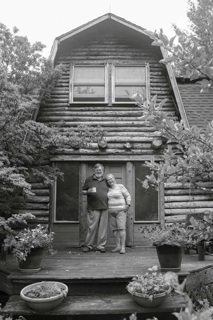 Susan C. Larkin&nbsp;• <em>Dan and Jean by the House that Dan Built</em>&nbsp;• Archival digital print&nbsp;• 18″×&nbsp;24″&nbsp;• $300.00