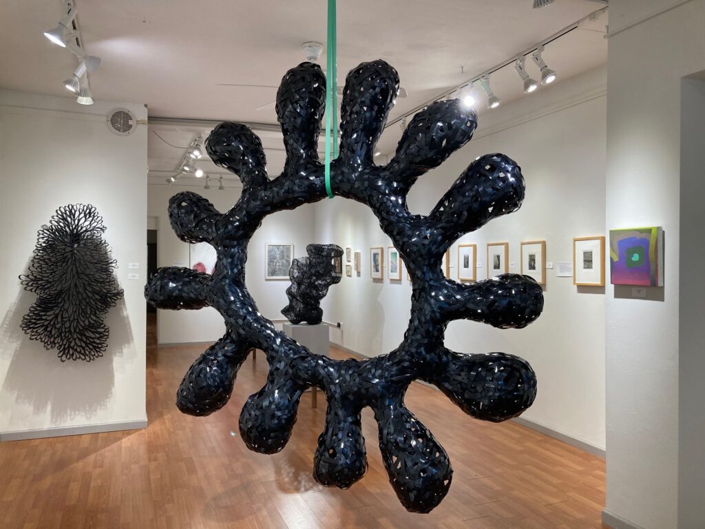 Bill Hastings&nbsp;• <em>Blight</em>&nbsp;• Post-consumer polyester, rivets&nbsp;• 68″×&nbsp;68″×&nbsp;10″&nbsp;• $1,800.00