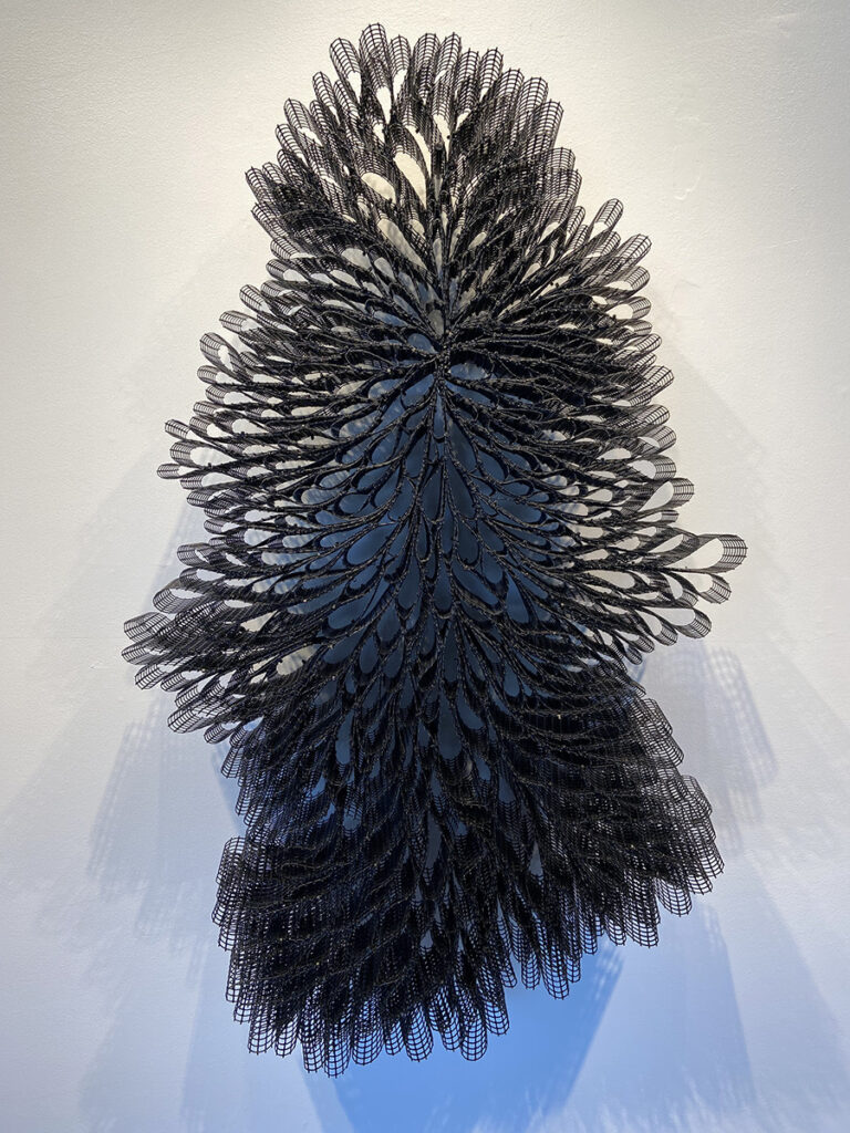 Bill Hastings&nbsp;• <em>Sway</em>&nbsp;• Post-consumer polyester, zip ties&nbsp;• 53″×&nbsp;33″×&nbsp;4″&nbsp;• $1,600.00