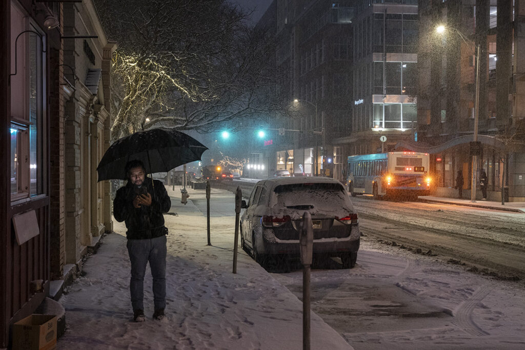 Harry Littell&nbsp;• <em>Man with Umbrella, Ithaca, 2024</em>&nbsp;• Archival digital print&nbsp;• 28″×&nbsp;21″&nbsp;• $475.00