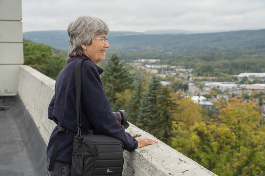 Susan C. Larkin&nbsp;• <em>Connie Thomas at the Former Morse Chain on South Hill</em>&nbsp;• Archival digital print&nbsp;• 20″×&nbsp;16″&nbsp;• $200.00