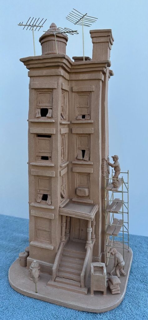 Richard Marchant&nbsp;• <em>Brownstone</em>&nbsp;• Stoneware clay and brass rod&nbsp;• 8″×&nbsp;20″&nbsp;• $600.00