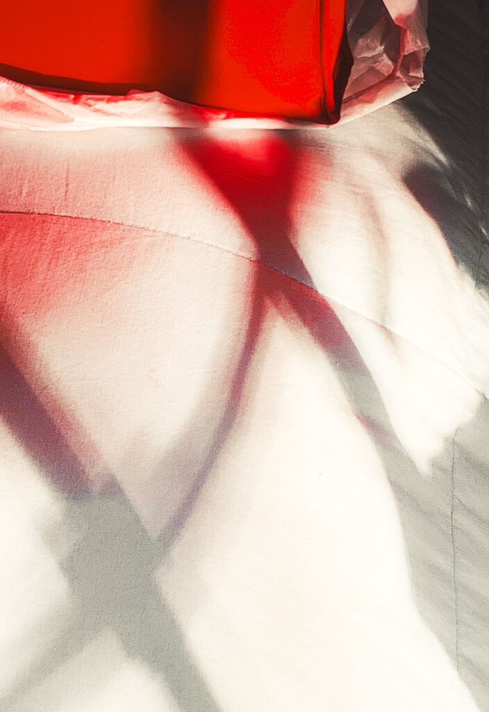 David Watkins, Jr&nbsp;• <em>Duvet, Red Purse, and Shadows</em>&nbsp;• Archival pigment print&nbsp;• 20″×&nbsp;24″&nbsp;• $275.00