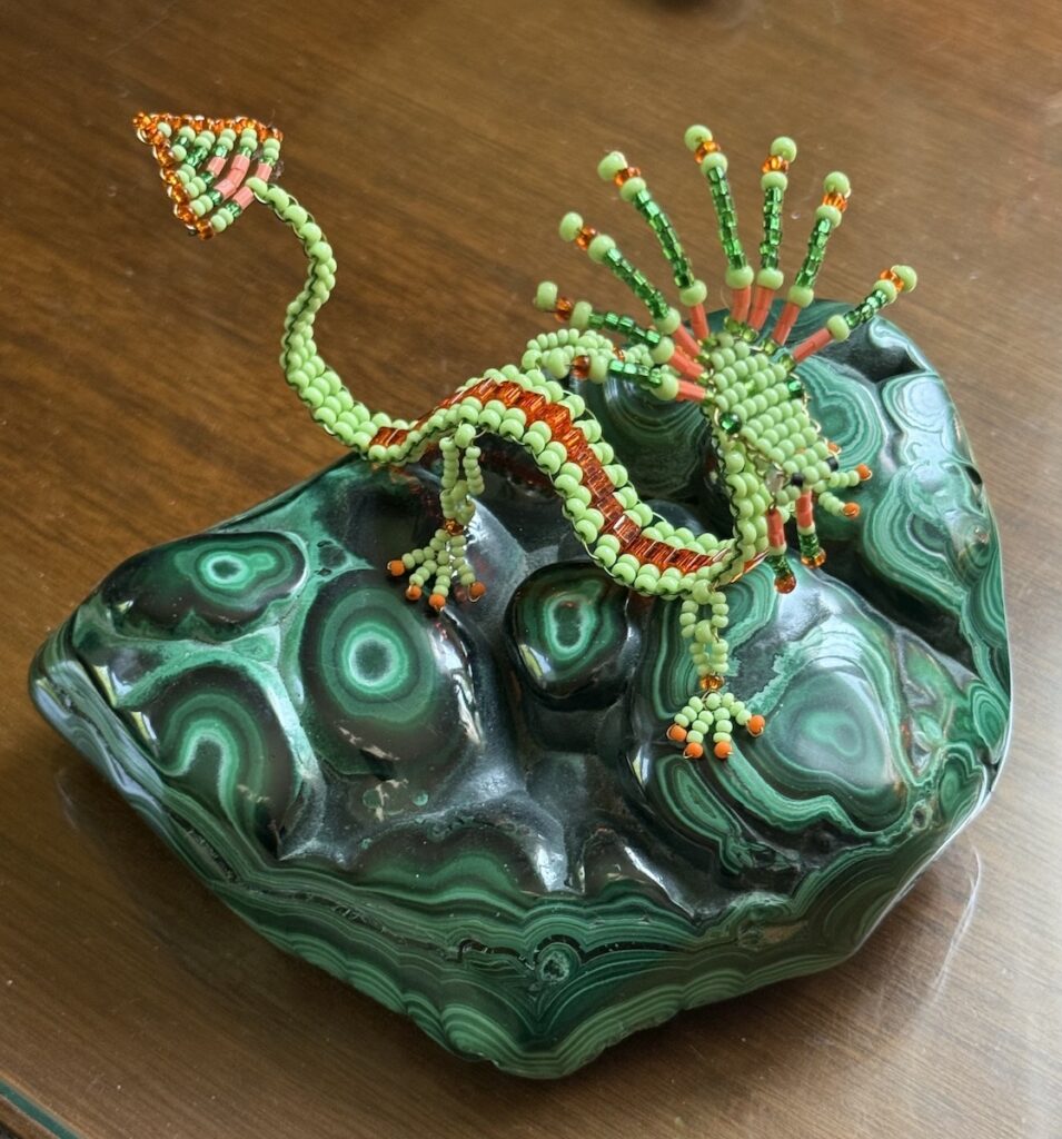 Frances L. Fawcett&nbsp;• <em>Green Dragon</em>&nbsp;• Glass beads, wire, stone&nbsp;• 5″×&nbsp;4″×&nbsp;5″&nbsp;• NFS