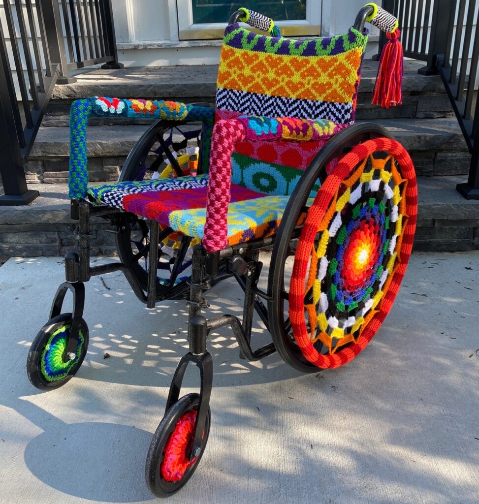 <span class="award_name">Honorable Mention</span>Betz White&nbsp;• <em>People First</em>&nbsp;• Knit and crocheted acrylic yarn over a secondhand wheelchair&nbsp;• 42″×&nbsp;25″×&nbsp;25″&nbsp;• $3,000.00