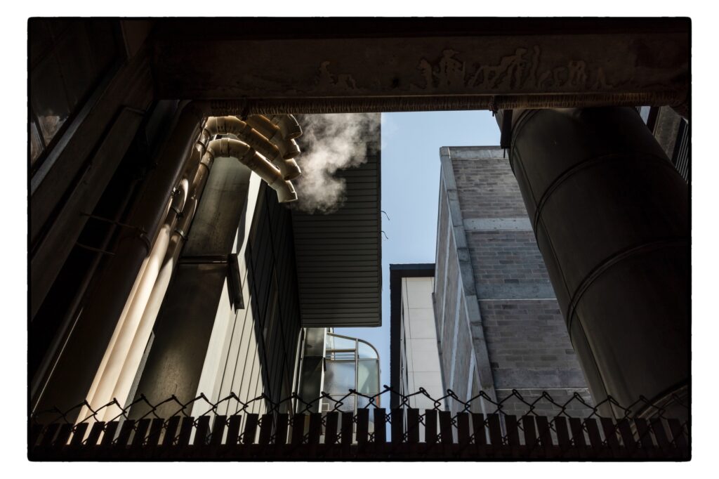Simon Wheeler&nbsp;• <em>Downtown Sky</em>&nbsp;• Digital print&nbsp;• 24″×&nbsp;18″&nbsp;• $500.00
