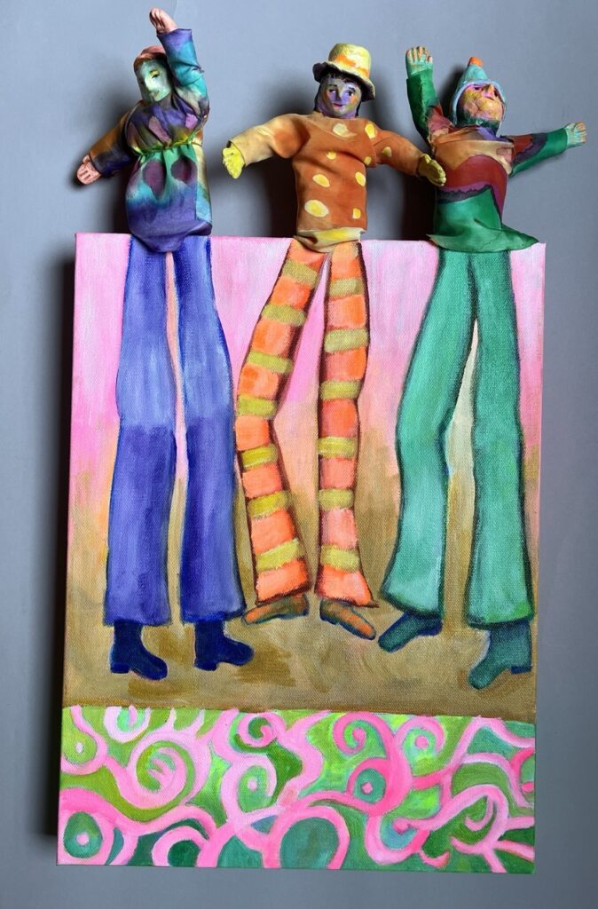 Jane Dennis&nbsp;• <em>Three Stilt Walkers</em>&nbsp;• Mixed media&nbsp;• 12″×&nbsp;22″&nbsp;• sold